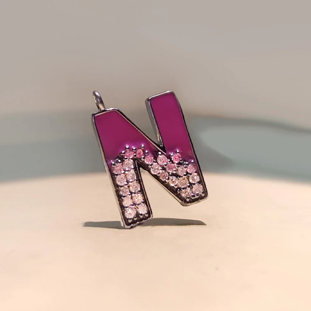 Diamond initial N pendant with enamel detailing